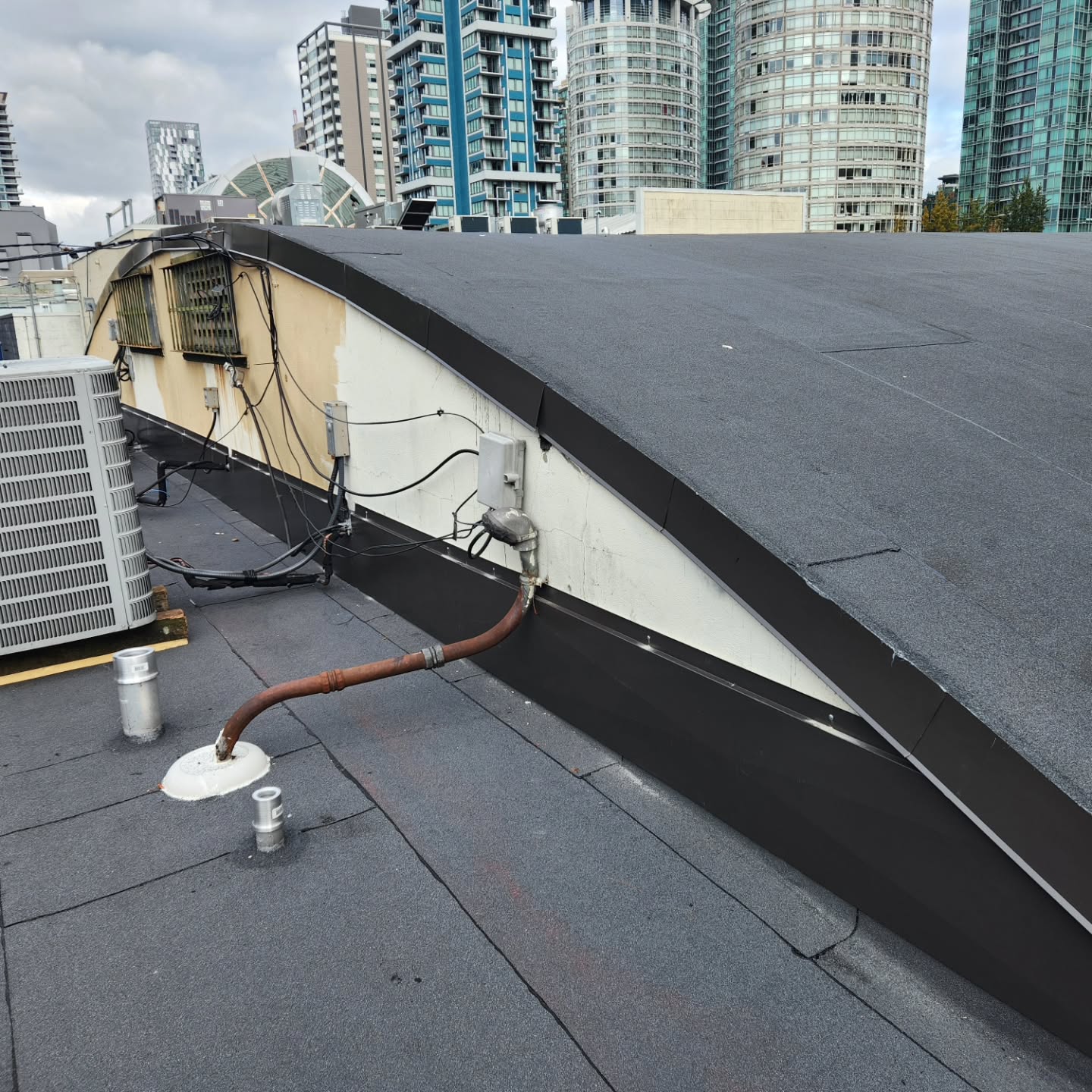 Precision bent metal work for roof edge detail in Abbotsford
