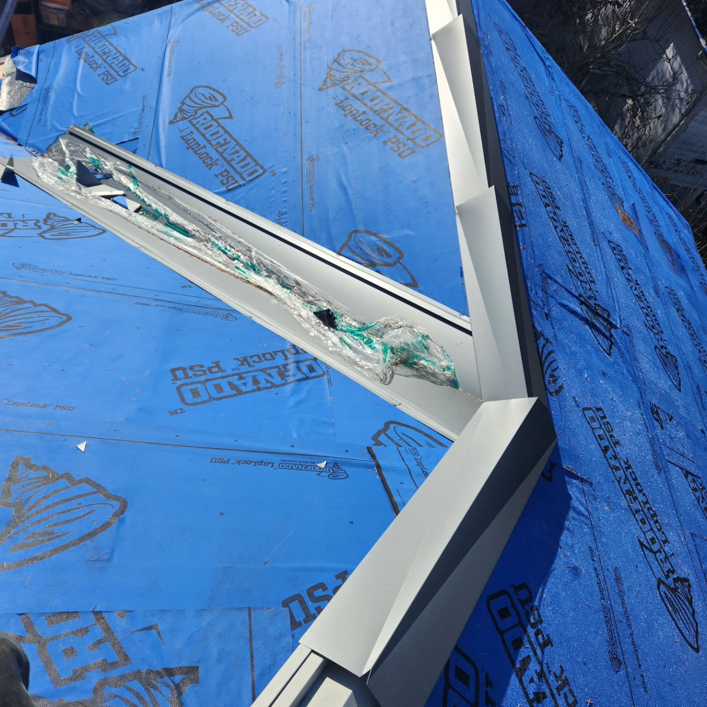 Sheet metal flashing installation on steep slope roof in Hope BC